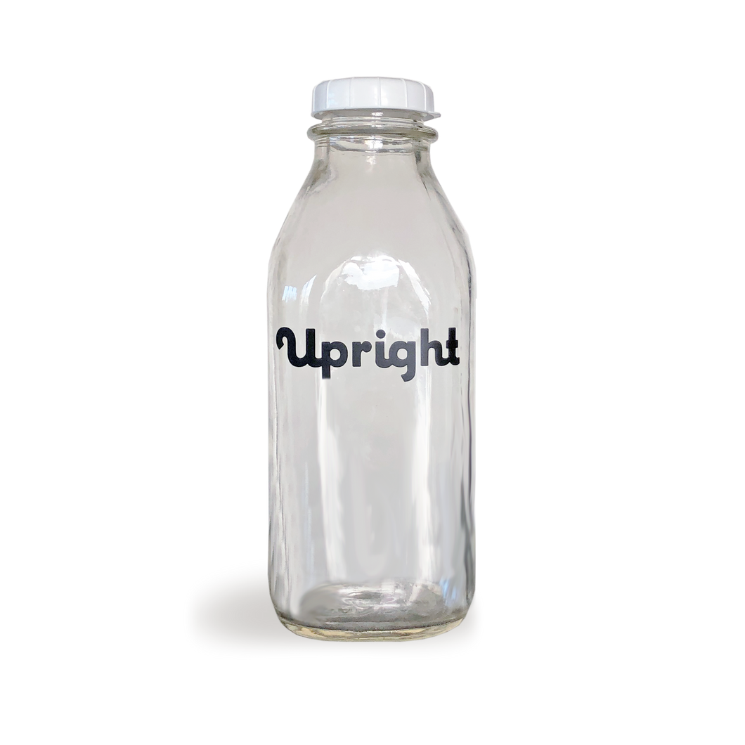 Upright glass milk bottle